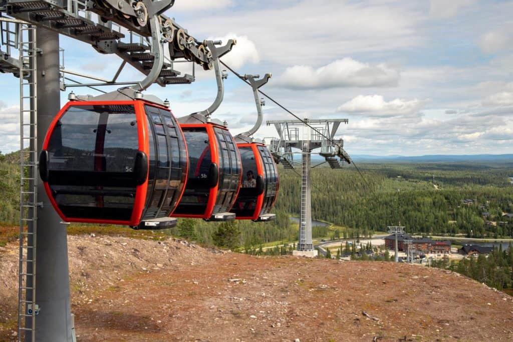 a gondola lifting people to the top of the fell