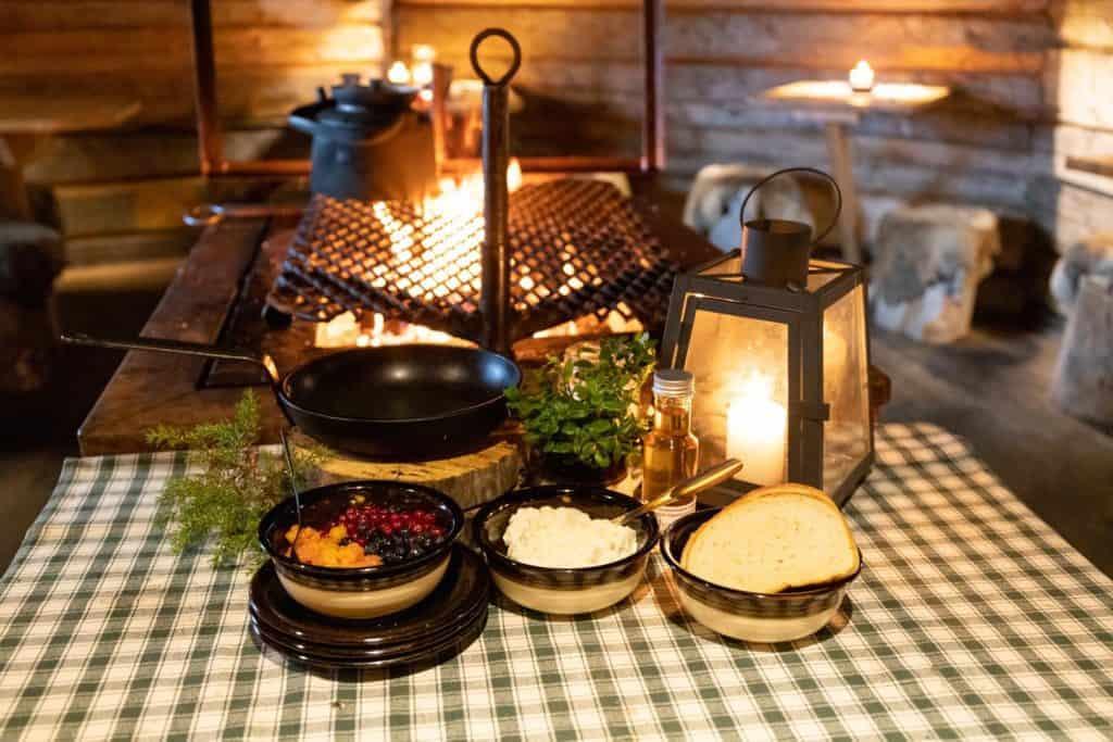 4 dishes of different foods on a restaurant table