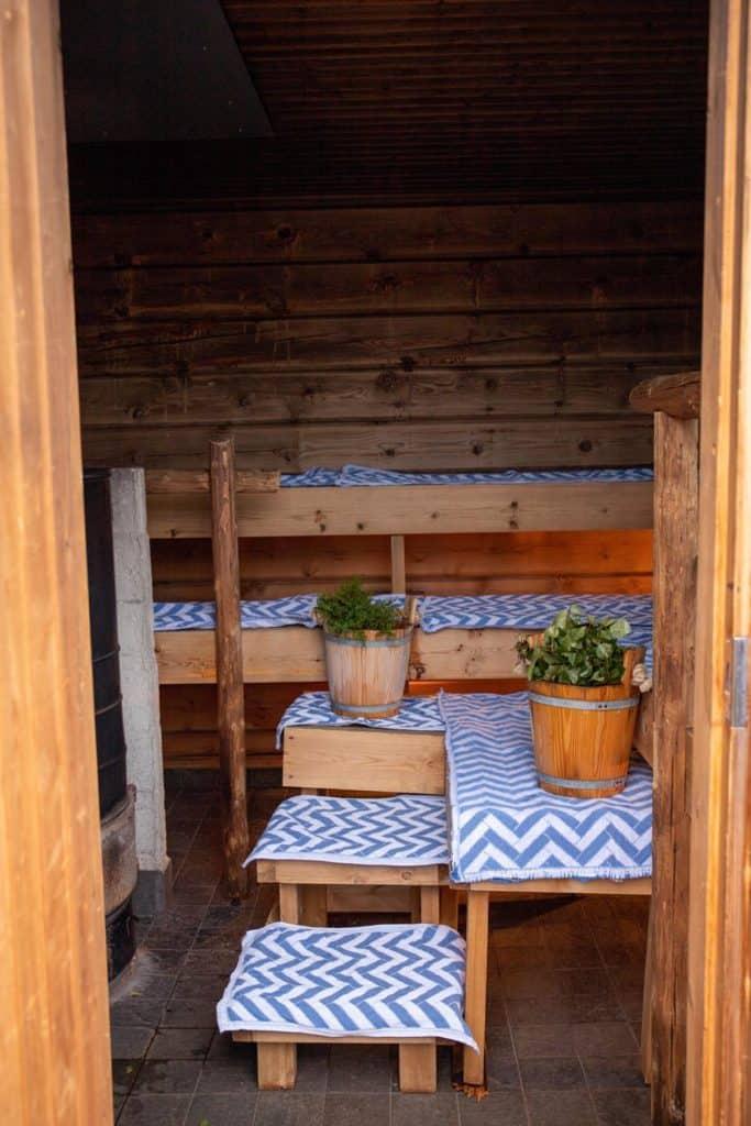 inside of a sauna with plants and cloths